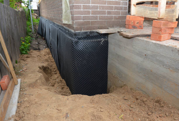 SJ Waterproofing Pros technician performing targeted Basement Waterproofing assessment in Le Roy, NY